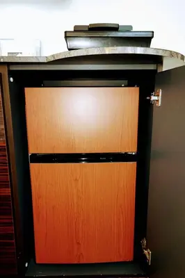 a wooden door in a cabinet with a counter top at The Baron\u897f\u65b0\u5bbf303\u30bb\u30eb\u30d5\u30b3\u30fc\u30d2\u30fc\u4ed8\u304d in Tokyo