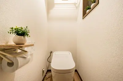 a small bathroom with a toilet and a plant at New! Ten people Shin Ookubo 6minPocket WIFI in Tokyo