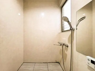 a bathroom with a shower with a glass door at New! Ten people Shin Ookubo 6minPocket WIFI in Tokyo