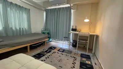 a room with a bed and a desk and a window at Terminal in Takadanobaba in Tokyo