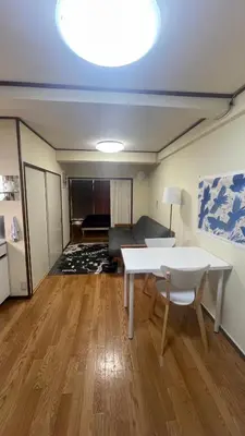 a living room with a white table and a couch at Terminal in Takadanobaba in Tokyo