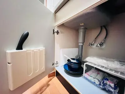 a kitchen with a stove and a pot on a shelf at Nishiwaseda-SJ0178 in Tokyo