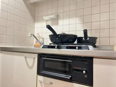 a kitchen with two pans on a stove at Nishiwaseda-SJ0178 in Tokyo