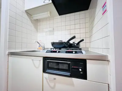 a kitchen with a stove with a pot on it at Nishiwaseda-SJ0178 in Tokyo