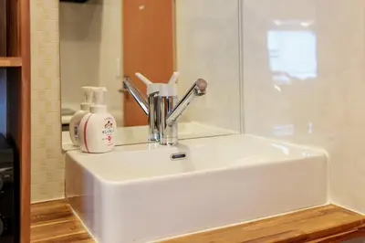 a bathroom sink with a soap dispenser on it at Nakanishiso 2F - Vacation STAY 30052v in Tokyo