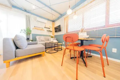 a living room with chairs and a table and a couch at Tokyo Skytree sta 2min walk, 2stop Asakusa sta-Stay SUU & Cafe- in Tokyo