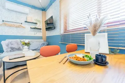 a dining room with a table with a bowl of food on it at Tokyo Skytree sta 2min walk, 2stop Asakusa sta-Stay SUU & Cafe- in Tokyo