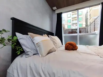 a white bed with a stuffed animal on it at Z22\u65b0\u5bbf\u6700\u4e2d\u5fc3 \u6771\u65b0\u5bbf\u7ad95\u5206-Shinjuku center 5 mins to Station, Max 4 \u76f4\u8fbe\u65b0\u5bbf \u6d89\u8c37 \u8868\u53c2\u9053 \u6c60\u888b \u4e0a\u91ce \u4ee3\u4ee3\u6728 \u94f6\u5ea7 \u539f\u5bbf in Tokyo