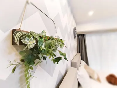 a potted plant hanging on a wall at S15\u65b0\u5bbf\u6700\u4e2d\u5fc3 \u6771\u65b0\u5bbf\u7ad95\u5206-Shinjuku center 5 mins to Station, Max 3P \u65b0\u5bbf \u6d89\u8c37 \u8868\u53c2\u9053 \u6c60\u888b \u4e0a\u91ce \u4ee3\u4ee3\u6728 \u94f6\u5ea7 \u539f\u5bbf in Tokyo