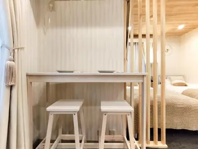 a room with a table and two stools and a bed at 62\u65b0\u5bbf\u6700\u4e2d\u5fc3 \u65b0\u5bbf\u5fa1\u82d1\u524d\u7ad95\u5206-Shinjuku center 5 mins to Station, Max 5P \u65b0\u5bbf \u6d89\u8c37 \u8868\u53c2\u9053 \u6c60\u888b \u4e0a\u91ce \u4ee3\u4ee3\u6728 \u94f6\u5ea7 \u539f\u5bbf in Tokyo