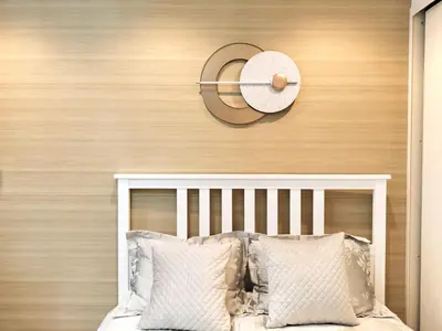 a bed with pillows and a hat on a wall at S13-Shibuya center 7 mins to Station, Max 4P\u6d89\u8c37\u6700\u4e2d\u5fc3 \u6d89\u8c37\u7ad97\u5206 in Tokyo