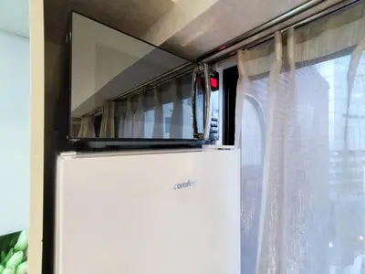a microwave on top of a refrigerator next to a window at S13-Shibuya center 7 mins to Station, Max 4P\u6d89\u8c37\u6700\u4e2d\u5fc3 \u6d89\u8c37\u7ad97\u5206 in Tokyo
