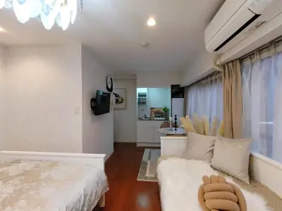 a bedroom with a white bed and a bathroom at S13-Shibuya center 7 mins to Station, Max 4P\u6d89\u8c37\u6700\u4e2d\u5fc3 \u6d89\u8c37\u7ad97\u5206 in Tokyo