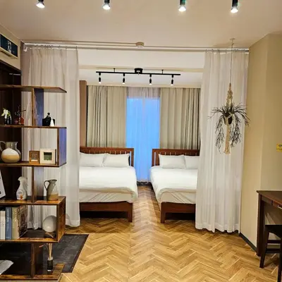 a bedroom with two beds and a window at supiahouse in Tokyo