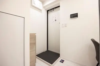 a walk in shower in a room with a mirror at Retaw Hills WASEDA in Tokyo