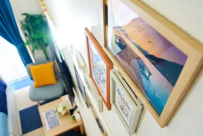 a row of pictures hanging on a wall at SC 103 Cozy Private Stay with Loft Near Station Free WiFi in Tokyo