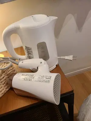 a white blender sitting on top of a table at 301\u53f7N\uff0b\u30db\u30c6\u30eb in Tokyo