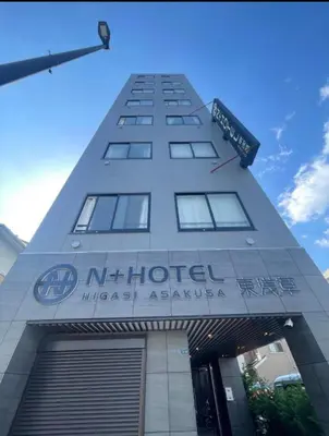 a building with a sign on the front of it at 301\u53f7N\uff0b\u30db\u30c6\u30eb in Tokyo
