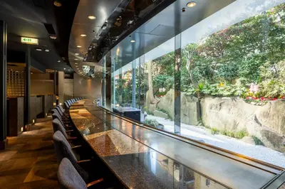 a long table with chairs in a restaurant at Shinjuku Washington Hotel Annex in Tokyo