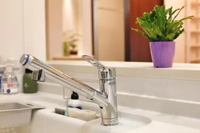a bathroom sink with a faucet and a mirror at kameido k hotel in Tokyo