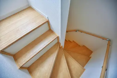 an overhead view of a wooden staircase in a room at kameido k hotel in Tokyo