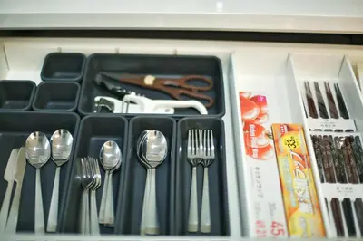 a drawer filled with utensils and forks and spoons at kameido k hotel in Tokyo