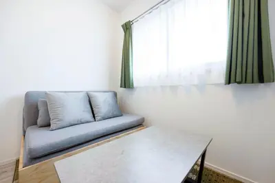 a living room with a couch and a table at \u30eb\u30cd\u30b5\u30f3\u30b9\u30b3\u30fc\u30c8\u81ea\u7531\u304c\u4e18 in Tokyo