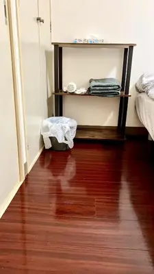 a room with a bed and a wooden floor at Shibuya Honmachi Hana House in Tokyo