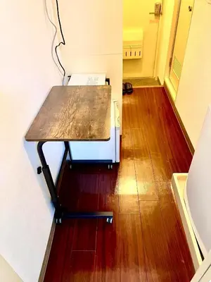 a wooden table sitting on top of a wooden floor at Shibuya Honmachi Hana House in Tokyo