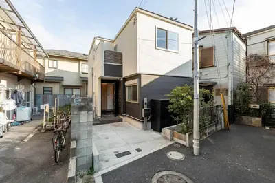 an empty street in front of a house at Relastay Kamata in Tokyo