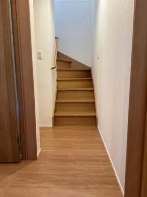 a staircase in a room with wooden floors at Relastay Kamata in Tokyo