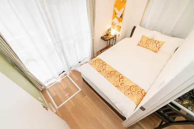 a small room with a bed and a window at KYARA Hotel\u30df\u30b9\u30df301 in Tokyo