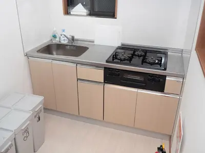 a kitchen with a stove and a sink at Lido North Shinagawa in Tokyo