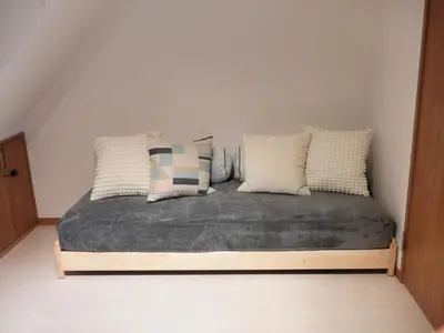 a bed with pillows on it in a room at Lido North Shinagawa in Tokyo