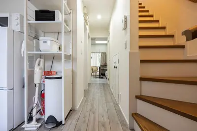 a hallway of a house with stairs and a room at Lido East Shinagawa\u3000 in Tokyo