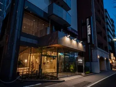 a store front of a building on a city street at Hotel Il Fiore Kasai Annex in Tokyo