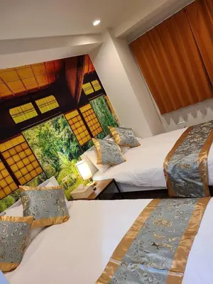 two beds in a room with a large window at 302\u53f7\uff2e\uff0b\u30db\u30c6\u30eb in Tokyo