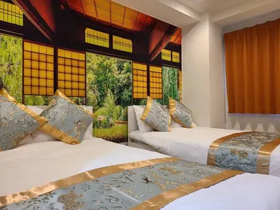 two beds in a room with two windows at 302\u53f7\uff2e\uff0b\u30db\u30c6\u30eb in Tokyo