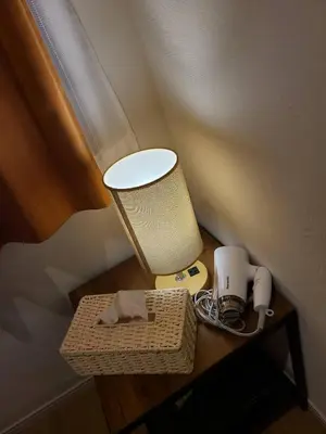 a table with a lamp and a box on it at 302\u53f7\uff2e\uff0b\u30db\u30c6\u30eb in Tokyo