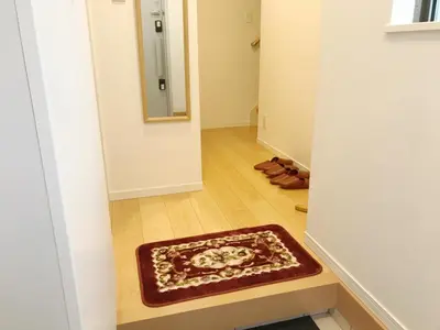 a hallway with a mirror and a rug on the floor at Tokyo Center Ikebukuro Family villa quiet 4BR group stay & parking near JR in Tokyo