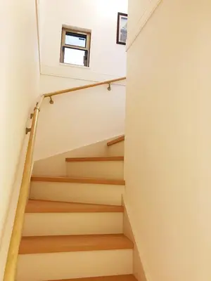 a staircase in a house with white walls and wooden floors at Tokyo Center Ikebukuro Family villa quiet 4BR group stay & parking near JR in Tokyo
