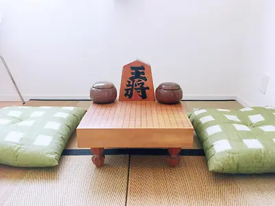a table with a sign on it next to two beds at Tokyo Center Ikebukuro Family villa quiet 4BR group stay & parking near JR in Tokyo