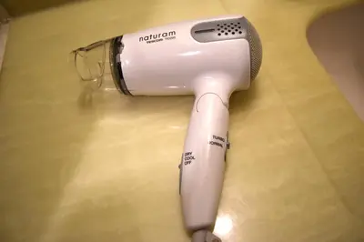 a hair dryer sitting on top of a table at \u6075\u6bd4\u5bff\u4e8c\u4e01\u76ee\u6238\u5efa in Tokyo