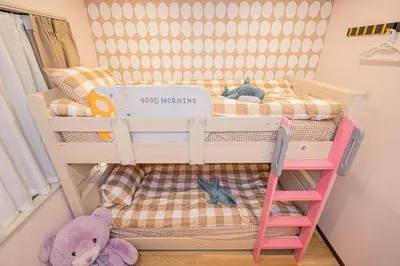 a bunk bed in a room with a teddy bear at Asakusa,Ginza,Ueno,Skytree,Stn&Conv 1min ,Family suite,45 Mins to Airport,Kiyoka Villa 清禾 in Tokyo