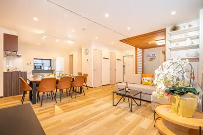 a living room with a couch and a table at Asakusa,Ginza,Ueno,Skytree,Stn&Conv 1min ,Family suite,45 Mins to Airport,Kiyoka Villa 清禾 in Tokyo