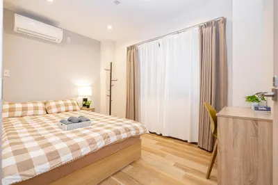 a bedroom with a bed and a large window at Asakusa,Ginza,Ueno,Skytree,Stn&Conv 1min ,Family suite,45 Mins to Airport,Kiyoka Villa 清禾 in Tokyo