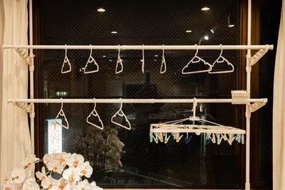 a group of shoes hanging in a store window at Asakusa,Ginza,Ueno,Skytree,Stn&Conv 1min ,Family suite,45 Mins to Airport,Kiyoka Villa 清禾 in Tokyo