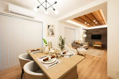 a dining room and living room with a table and chairs at GIVE Kagurazaka in Tokyo