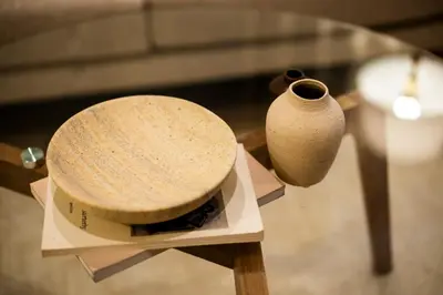 a table with two vases sitting on top of it at GIVE Kagurazaka in Tokyo