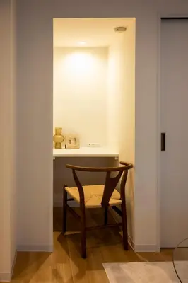 a table and a chair in a room at GIVE Kagurazaka in Tokyo